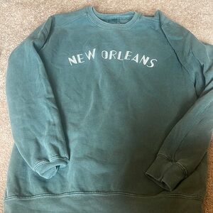 New Orleans crewneck, never worn. Color is faded green